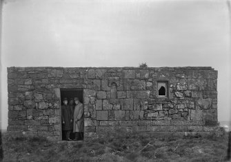 View of St. Serf's Priory with three men in the doorway.
Titled: 'Loch Leven. St Serf's Island. Chapel from S'.