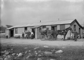 General view of building including horse and cart in foreground outside of 'D. Cameron, Groceries & Provisions, Refreshments and Wines & Spirits'. Possibly business of Duncan Cameron located near Rannoch Station or Kinloch-Rannoch.