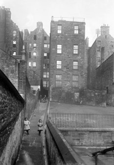 View to rear of Nos 80, 82, 84 and 86 High Street, within Dickson's Close, with children playing in Close