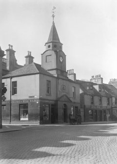 General view from NE of Stranraer Old Town Hall and a butcher shop and the Railway Inn