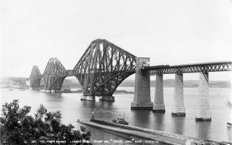 General view of the Forth Bridge in use seen from the South West.
Insc. '673 The Forth Bridge. Length 8296 Ft, height 354 Ft, spans 1,700 Ft each. 
J. Patrick.'


