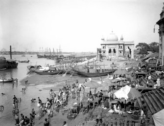 Riverside scene with bathers, looking north from Chatulal's Ghat towards Ram Chandra Goenka's Zenana (ladies) ghat, Kolkata.
