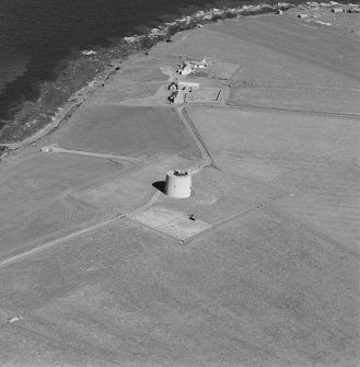 Oblique aerial view centred on Martello tower from W.