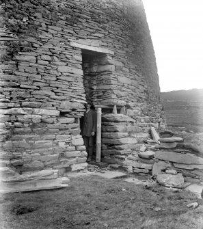 View of altered entrance, Mousa Broch with standing figure.