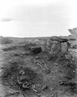 View of skeletons uncovered outside chapel.