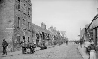 View of Main Street, Newhaven, Edinburgh. 
Titled: 'Newhaven, Main Street'.
