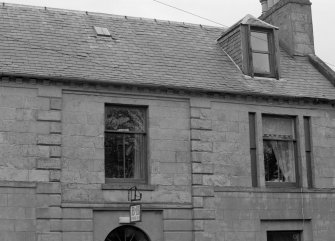 Scanned image of detail of first floor windows and dormer.