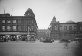 General view of 10 - 15 Princes Street, including F W Woolworth & Co and General Register House with New Register House clearly visible in the background.