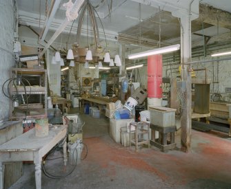 Interior. Lower ground floor. View of workshop from SSW