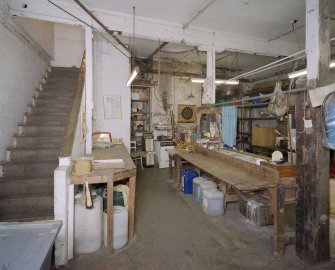 Interior. Lower ground floor. View of workshop from S