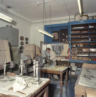 Interior. Ground floor. Machine room. View from NW