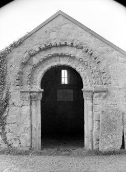 View of Norman doorway with gates to burial vault open.