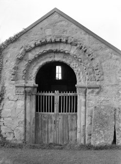 View of Norman doorway with gates to burial vault closed. Edrom Parish Church.