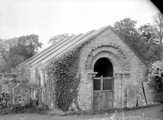 General view of burial vault with Norman doorway.