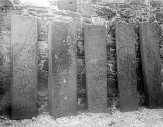 Mull, Inchkenneth Chapel.
Detail of 5 grave slabs ranged against West wall.