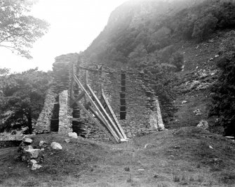 View taken from the SE, showing timber shoring bracing the interior of the wall.