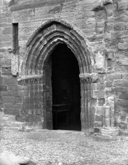 Historic photograph showing detail of entrance doorway to sacristy.