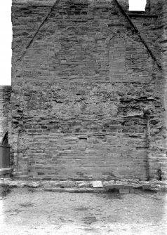 Historic photographic interior detail of wall of S transept showing scar lines of chapter house roof.