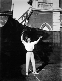 Unknown man playing tennis.  Unknown location.