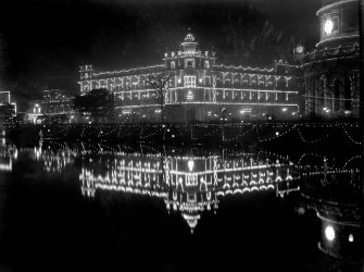 Royal Insurance Building, Kolkata from across the Lal Dighi tank at night, lit for the British royal visit.