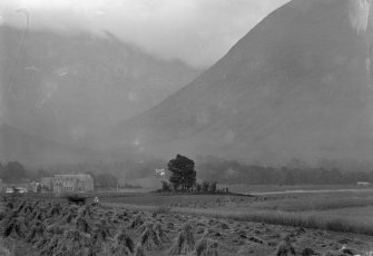 Distant view of hotel, showing its setting