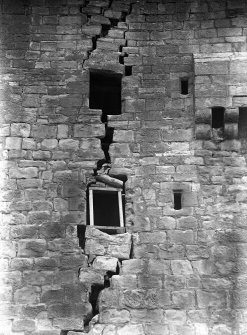 View of damaged wall in old tower.