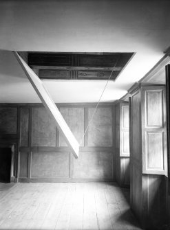 Interior. Raised trap door showing interior panelling