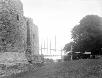 View of construction of wooden bridge across moat.
