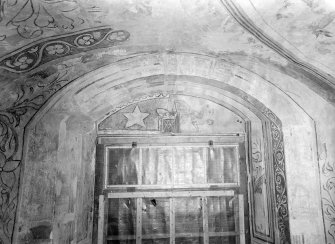 Interior.
Detail of painted work above door in N room.