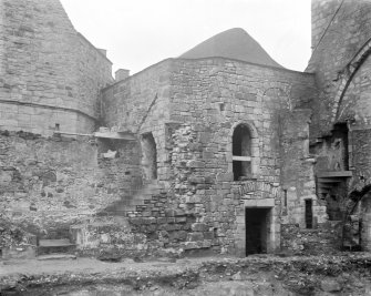 North East corner of court, showing stairway, original position of arches & roof