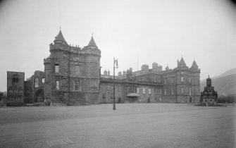 General view of main entrance front of Holyrood Palace showing James IV's Tower, part of Holyrood Abbey and Fountain in forecourt