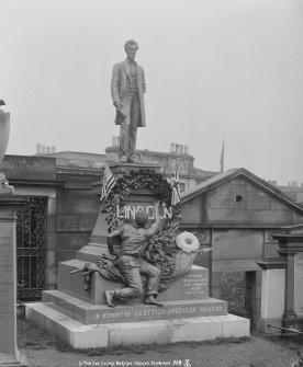 General view of American Civil War Memorial in Old Burial Ground in Waterloo Place with wreaths and floral tribute to "Lincoln".
Insc. "In the Old Calton Burying Ground, Edinburgh.  228. AI."