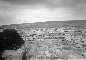 View of remaining walls of domestic buildings.