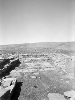 View of remains of walls of domestic buildings.