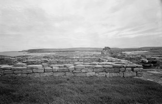 View of remaining walls of domestic buildings from NE.