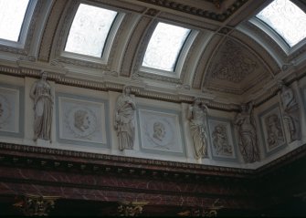 View of the frieze in the Hall, showing portrait profiles of William Smellie, Herman Boerhaave and Thomas Sydenham, with representations of Hygeia, and two panels carved with a cherub.