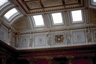 View of the frieze in the Hall, showing portrait profiles of Mathew Bailie, John Abercrombie and John Thomson, with representations of Hygeia, the coat of arms of the Royal College of Physicians and two panels carved with a cherub.