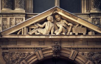View of pair of putti, in triangular pediment above entrance to Jenners on South St David Street, Edinburgh.