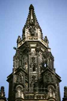 View of statue of Dominie Sampson, on the fourth gallery (top of Scott Monument), W side. Supporting the fourth gallery are druids.