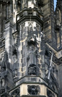 View of statue of Friar Tuck (centre), on upper tier of SE buttress. (The statue on the far left is of Oliver Cromwell.)