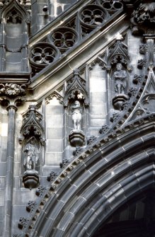 View of statues of Peter Peebles, Constance and Wayland Smith (left to right), above ground floor arch, S side.