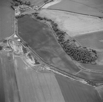 Oblique aerial photograph of Milton, Leuchars and Pusk Wood centred on cropmarks, taken from the N. The cropmarks of cultivation remains, a possible souterrain and a sunken floored house are situated to the W. A Cropmark complex is situated to the NE, in the bottom left corner of the photograph.