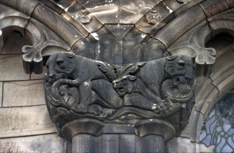View of double capital of niches on E wall, carved with a group of animals (including lions and snakes). Scottish National War Memorial, Edinburgh Castle.