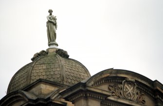 View of statue representing Plenty, on top of E dome.