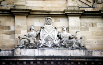 View of carved Bank of Scotland coat of arms, at the base of the central octagonal drum, S side of building.