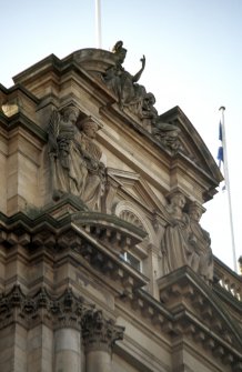 View from NE of statues representing Britannia and her children, within pediment at top of central bay, N side, with two pairs of caryatids below.