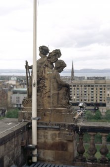 View from S of group of putti, at NW corner of balustrade, second floor.