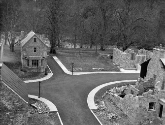 Taymouth Castle, Military Camp.
View of training area - cross-roads at North end of Town Street from rescue tower. The sets shown are as follows:- (Left to right) Shoring and Needling and basement Rescue in background with Rescue under war gas conditions and rescue reconnaissance in foreground.