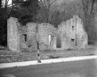 Taymouth Castle, Military Camp.
View of training area showing 'Rescue under war gas conditions' with timber strutting on damaged gable.
Timber strutting on damaged gable will be removed when set is dressed to allow for collapse of first floor.