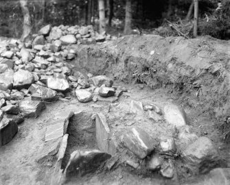 View of Kalemouth cairn during excavation showing cist.
